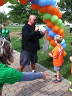 Q104 FM's Allan Fee announced the names of every child crossing the finish line, because every child was a winner (complete with ceremonial medal).