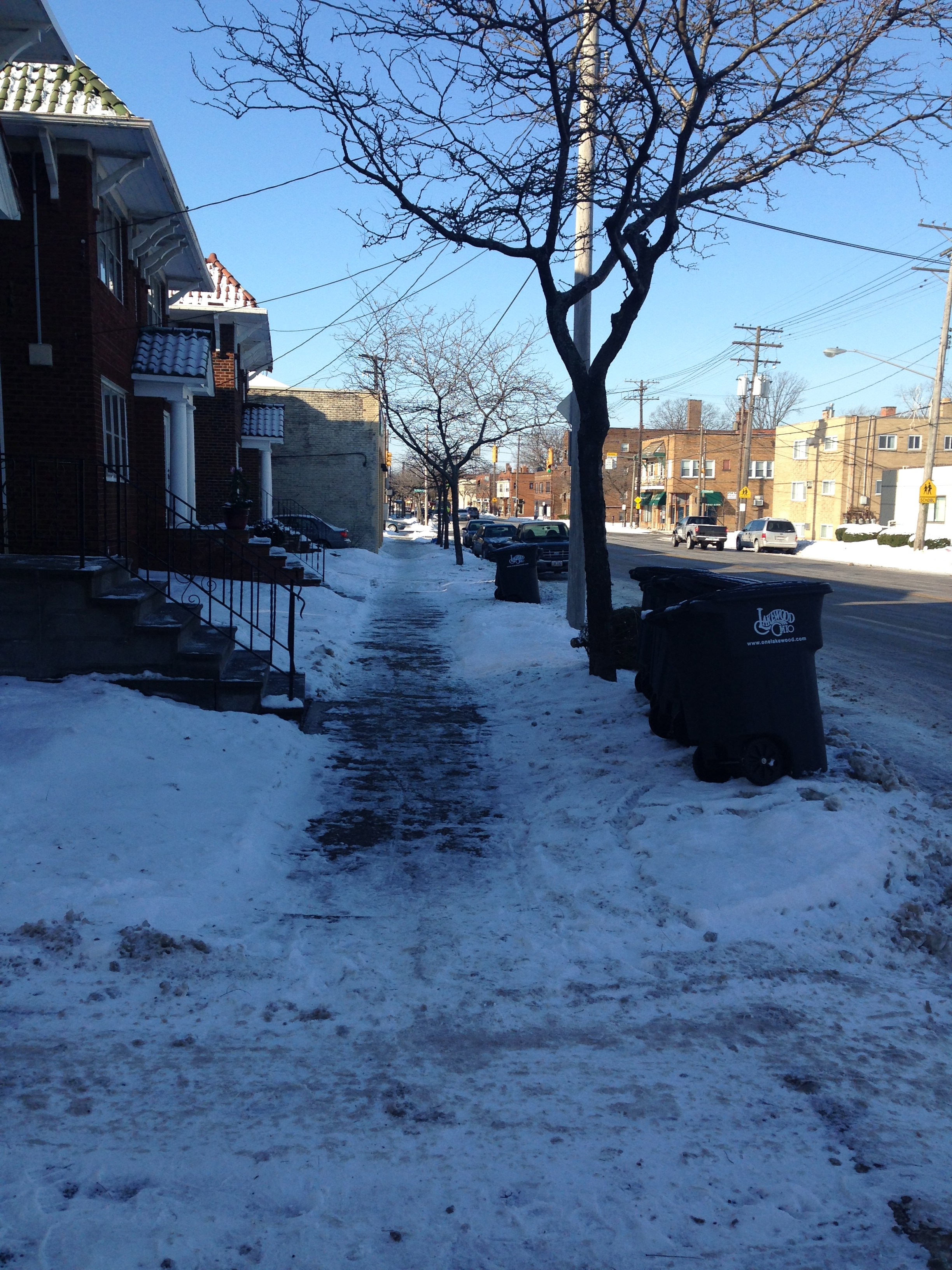 All but one of the apartment buildings along this stretch of Madison had their sidewalks clear.