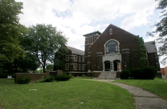 The former Church of the Good Shepherd on South Main Street in Akron as well as it's parking lot and the building housing the Verizon business behind it will be bought by Rubber City McDonald's for a new franchise and to make way for a new corporate headquarters. (Karen Schiely/Akron Beacon Journal)